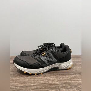 New Balance Men's Black and Gray Athletic Shoes with Yellow Accents